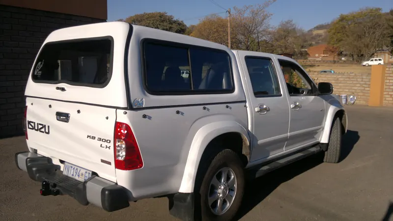 Silver Isuzu KB double cab with colour-matched canopy
