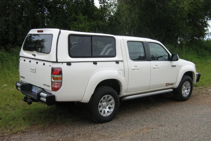 White Mazda BT-50 double cab fitted with a Club canopy.