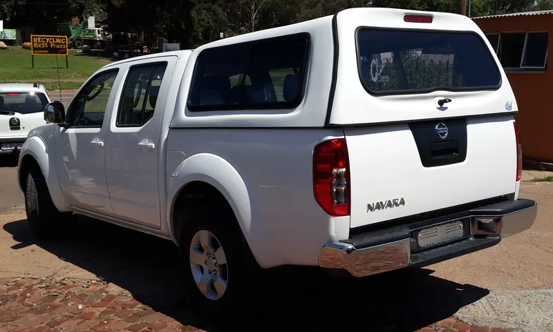 White Nissan Navara double cab with a Standard canopy