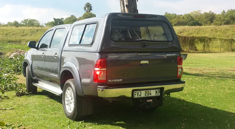 Grey Toyota Hilux Raider double cab with colour-matched canopy