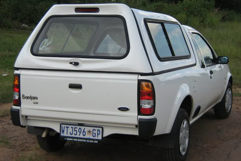 White Ford Bantam with a colour-matched canopy.