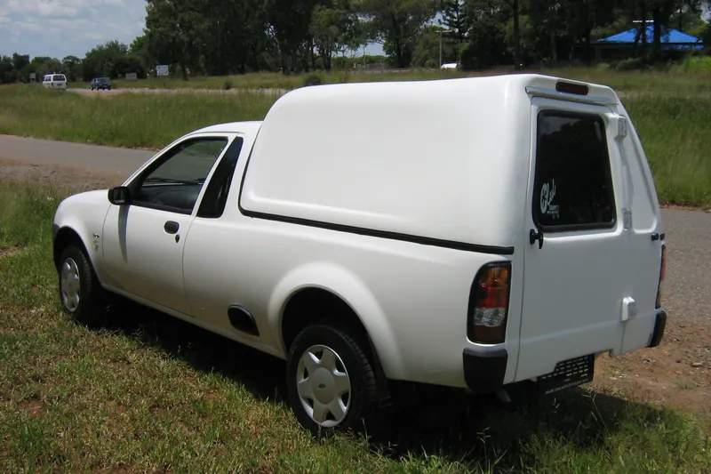 White half-tonne bakkie with a Space Saver canopy.
