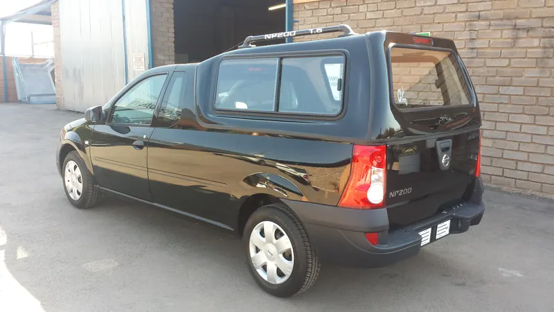 Black Nissan NP200 with canopy and roof rails