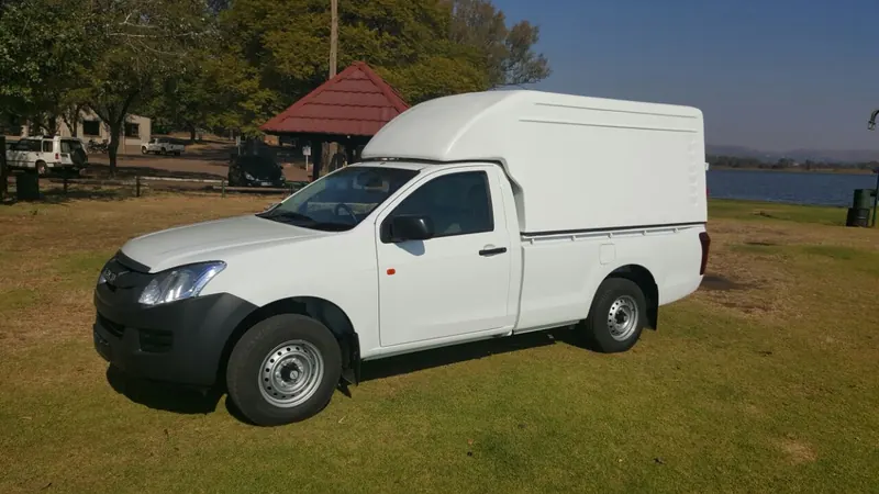 White Isuzu KB single cab with a Space Saver canopy.