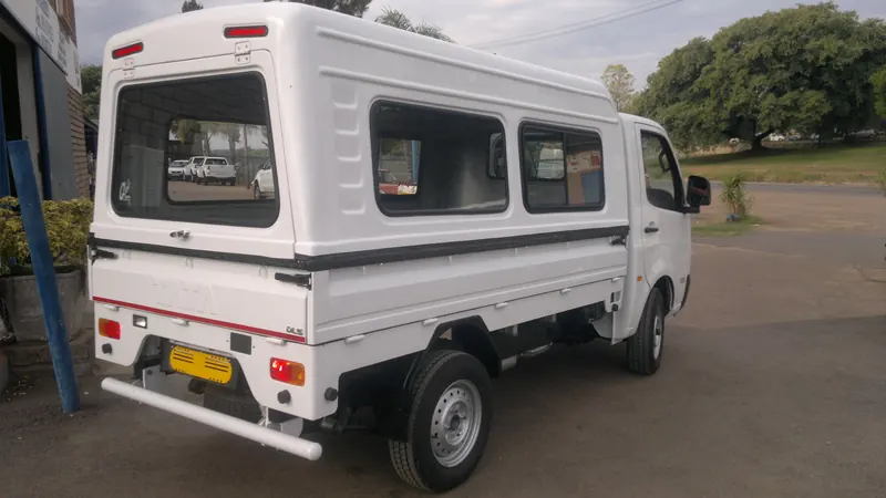 White Tata Super Ace with a canopy with side windows.