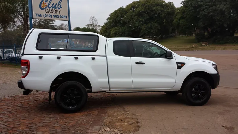 White Ford Ranger SuperCab with a colour-matched canopy.