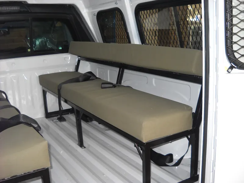 Padded bench seats fitted inside a canopy