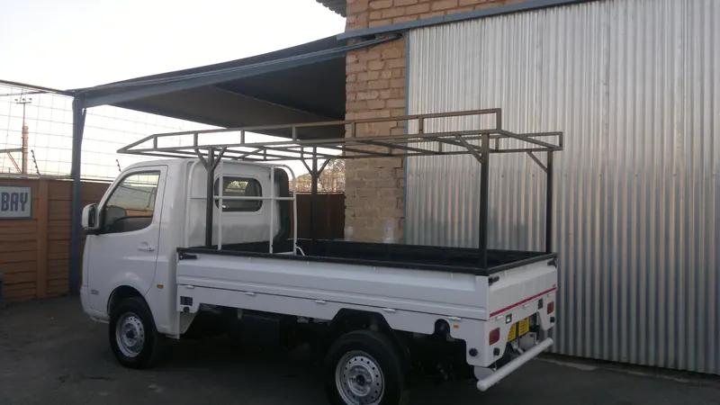 Tata Super Ace dropside fitted with a steel frame rack